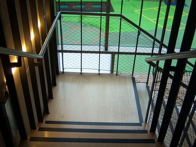 Stairs suspended through 4 floors from the top of the building