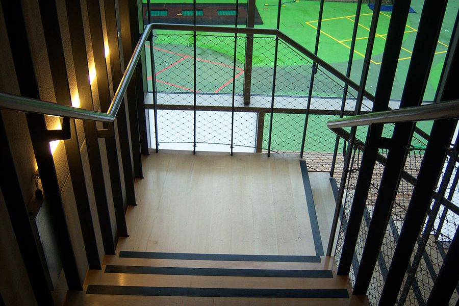 Stairs suspended through 4 floors from the top of the building