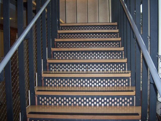 Stairs suspended through 4 floors from the top of the building